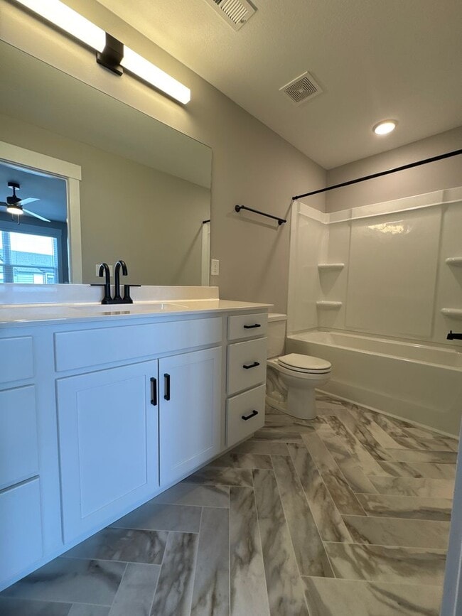 Building Photo - “Stylish 3BR End-Unit | Open Concept | Quartz Kitchen | Garage + Deck