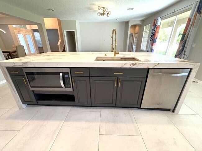 Building Photo - Available NOW!  Stunning 5-Bedroom Home in Gated Avalon Lakes Community