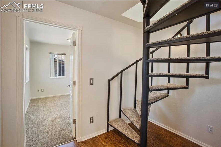 Second Bedroom and Spiral Staircase to Master Bedroom - 206 W Carr Ave