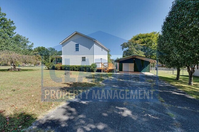 Building Photo - Updated house with carport and shed on corner lot!