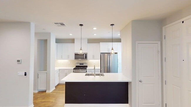 Building Photo - Bayfront Coastal Condo at The Strand | 3BR + 2-Car Garage, Resort-Style Amenities