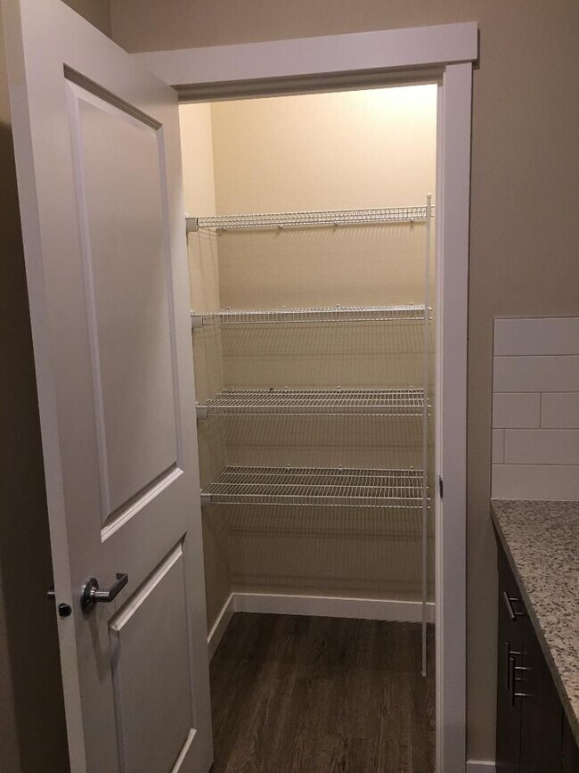 Building Photo - Stunning 1-Bedroom with Upscale Interiors & Open Island Kitchen!