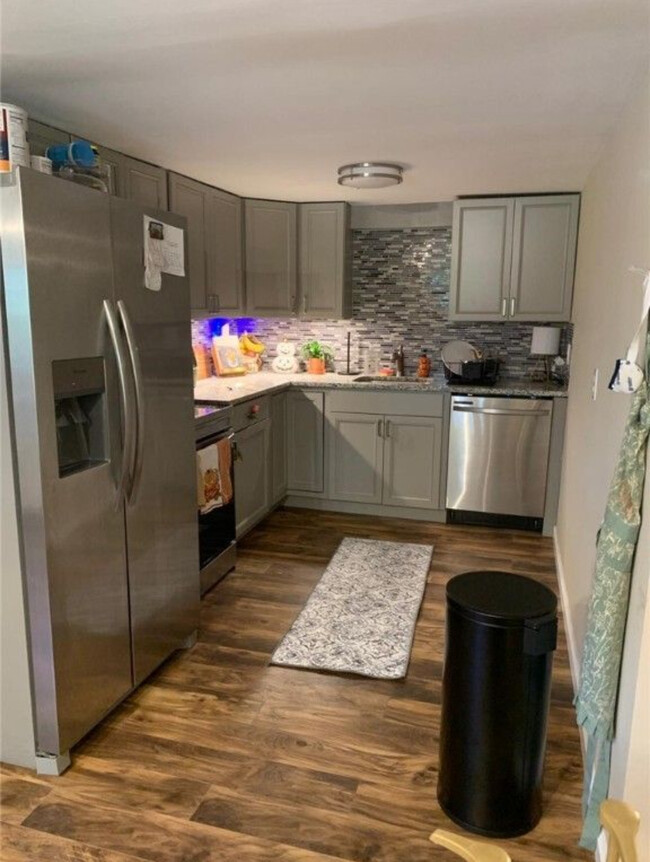 Modernized kitchen including dish washer refrigerator and microwave. - 726 Cliff St