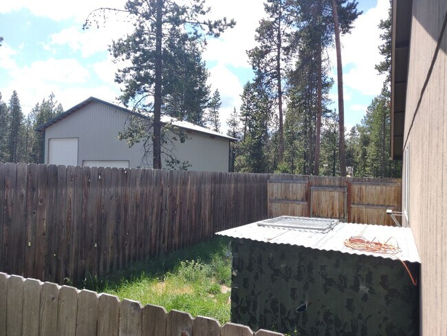 Building Photo - Charming 4-Bedroom Home on 1/2 Acre with a Fenced Backyard, Fully Insulated Double-Car Garage, in...