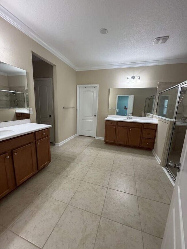 Building Photo - COMING SOON! Beautiful 4BR 3BA Home w/ Screened Lanai & Pond View • Garage Parking • Fenced Yard ...