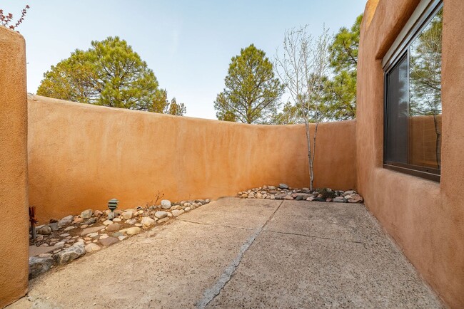 Building Photo - Two Story Condo Just off Old Taos Highway ...