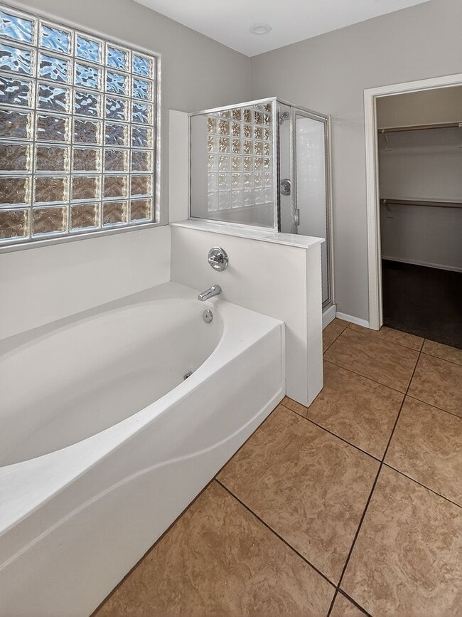 Building Photo - Single-level 4 bed, 2 bath home with tandem 3-car garage and RV gate.