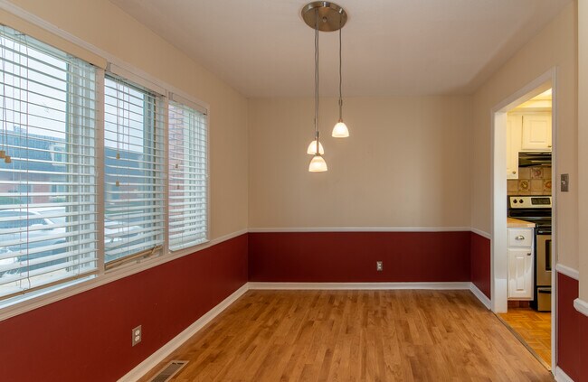 Large dining room with a quaint light for your dinner table - 8508 Canterbury Sq E