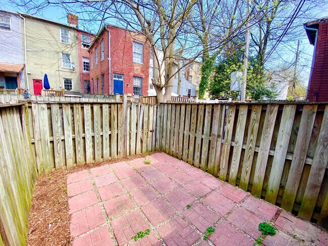 Building Photo - Charming 1BR with 1.5 Baths and Bonus Basement Room in the Heart of Ridgley’s Delight