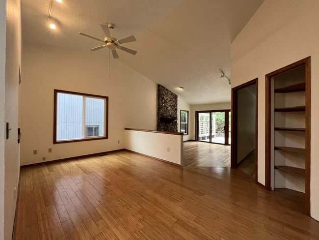 Building Photo - Spacious 3-Bedroom Home with Custom Stone Fireplace, Attached 2-Car Garage & Expansive Backyard i...