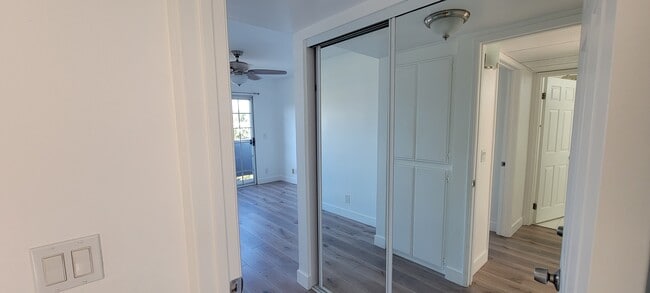 Entrance to master bedroom with closet and balcony view - 14126 Tiara St