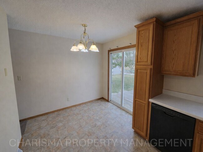 Building Photo - 4 BD, 2 BA - FENCED IN YARD, PRIVATE TRAILS, FINISHED UPPER AND LOWER LIVING AREAS, ATTACHED GARAGE!
