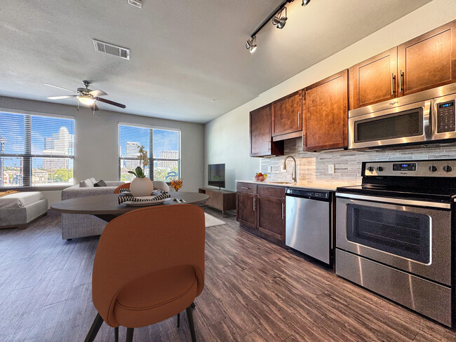 Experience city living with this stylish open-plan apartment, featuring sleek design and natural light. - Midtown Houston Living