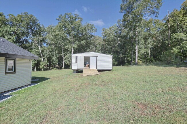 Building Photo - COMING SOON · Designer Renovation · Covered Deck Pavilion · 2-Car Garage · Lawn Care Included