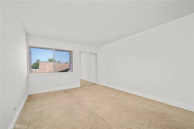 Building Photo - "Chic 1-Bed Retreat with Pool & Central Vacuum in Anaheim's Heart – 710 Sq Ft of Hardwood Elegance!"