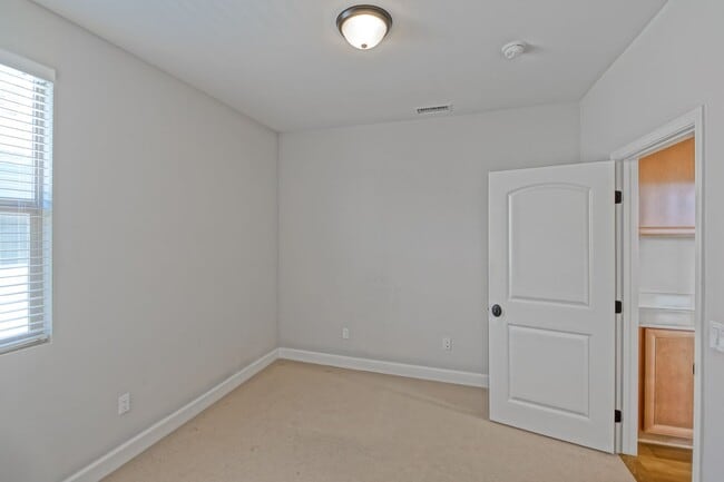 Building Photo - BUILT IN 2019: SPACIOUS & BRIGHT, DETACHED TOWNHOUSE W/ 2-CAR GARAGE & FENCED YARD IN GREAT RESID...