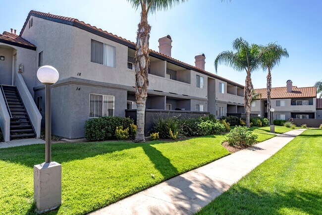Sedona Apartments in Moreno Valley features freshly painted exteriors and beautifully manicured lawns, offering a vibrant, well-kept community to call home. - Sedona Apartment Homes