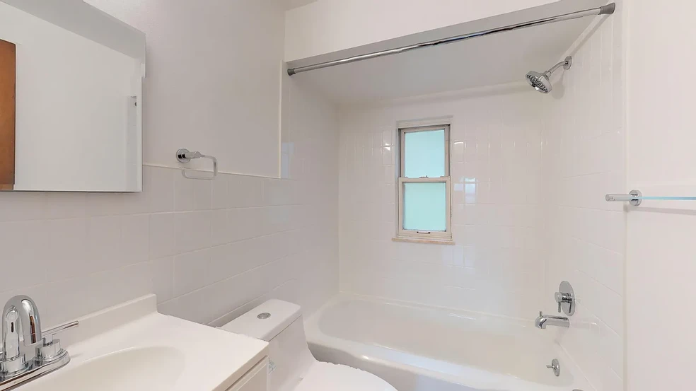 Completely remodeled bathroom with vertical subway tile, new chrome fixtures and vanity cabinet - 31 Marylea Ave