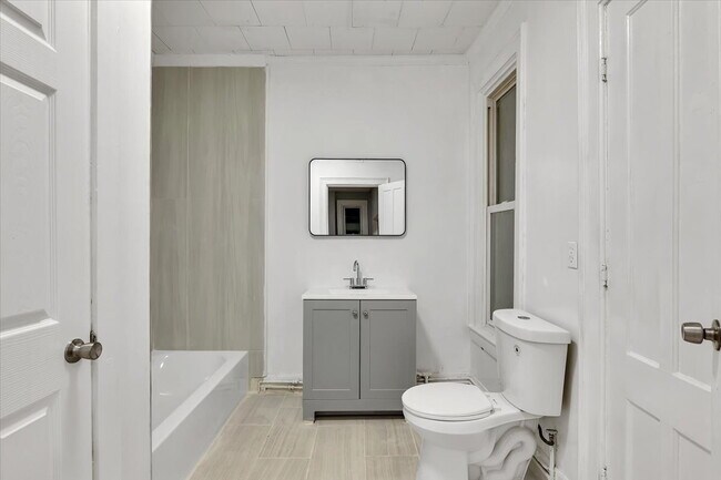 Building Photo - "Spacious 3-Bed Home at 57 1/2 Saratoga Av...