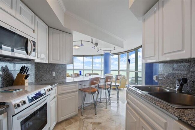 Building Photo - 6301 Collins Ave