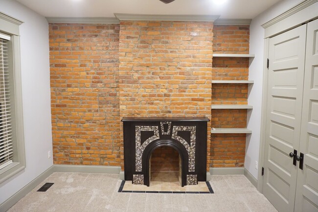 exposed brick and restored mantel - 1295 Kutchins Pl