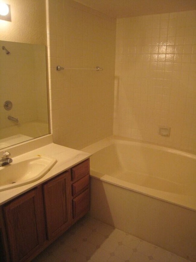 Building Photo - 2nd Story Condo in gated community close to the pool.