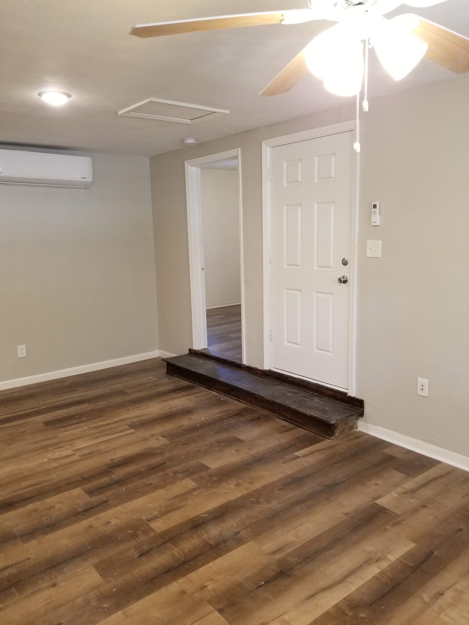 View of Front door and entry into Bedroom - 601 N Pruett St