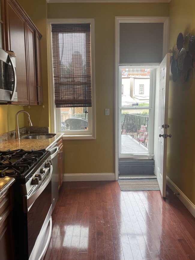 Kitchen leading to backyard - 400 Eldert Ln