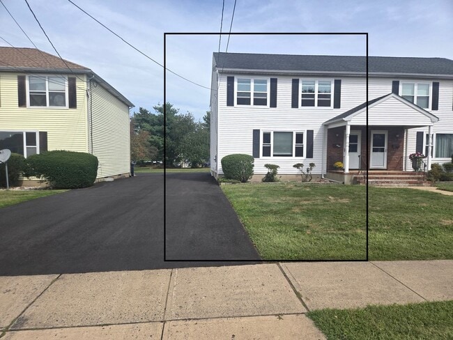 Building Photo - Updates abound at this SPACIOUS, half dupl...