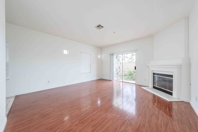 Building Photo - Gated Townhome with Updated Kitchen and Private Backyard