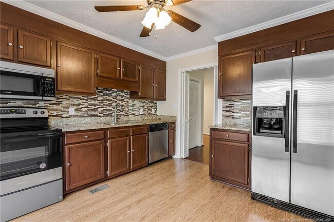 Building Photo - 6837 Woodmark Dr