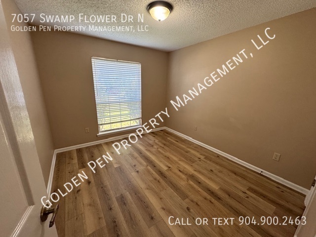 Building Photo - 7057 Swamp Flower Dr N