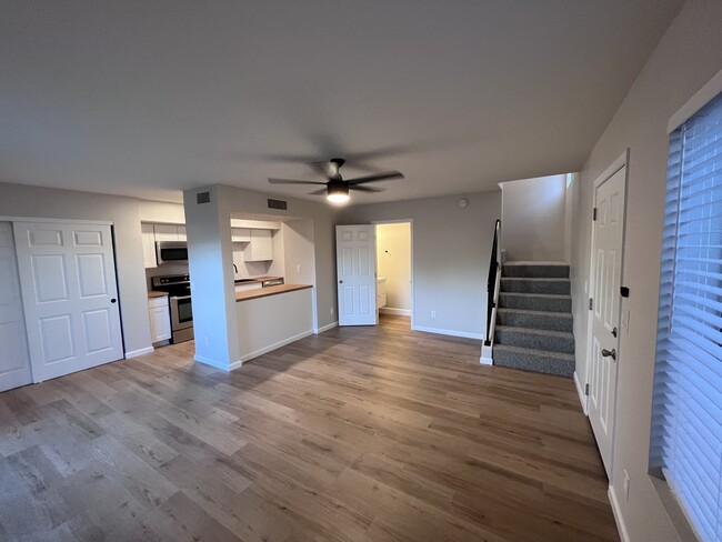 Kitchen, living room and half bathroom downstairs - 7602 N 61st Ave