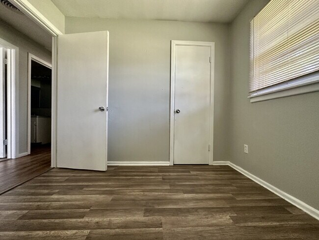 Building Photo - Updated Home with Gorgeous Floors & Large Backyard