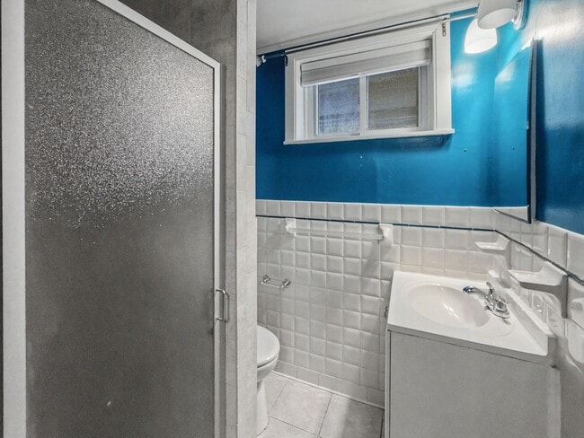 Building Photo - Furnished 4BD 2BA Home with Two kitchens, Basement, and Garage!