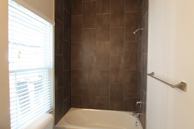 Building Photo - Midtown Renovated Duplex - Hardwood Floors, Exposed Brick