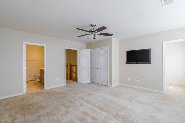 Spacious master bedroom with two large closets (one walk in closet) ceiling fan with remote, large windows with plantation shutters and flat screen HD TV included with rental. - 22785 Settlers Trail Terrace