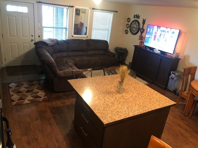 Family room shown with furniture. - 1220 W Bismark Ave
