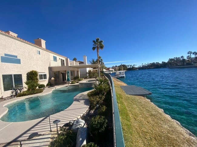 Building Photo - Vegas's Only Available Waterfront Rental ~ 4 Bedroom Desert Shores Lake Front Home