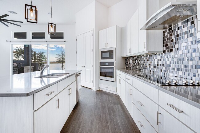 Building Photo - Luxurious Solar Powered 4 Bedroom, 3 Bath Waterfront Home with office & Upgrades Galore!