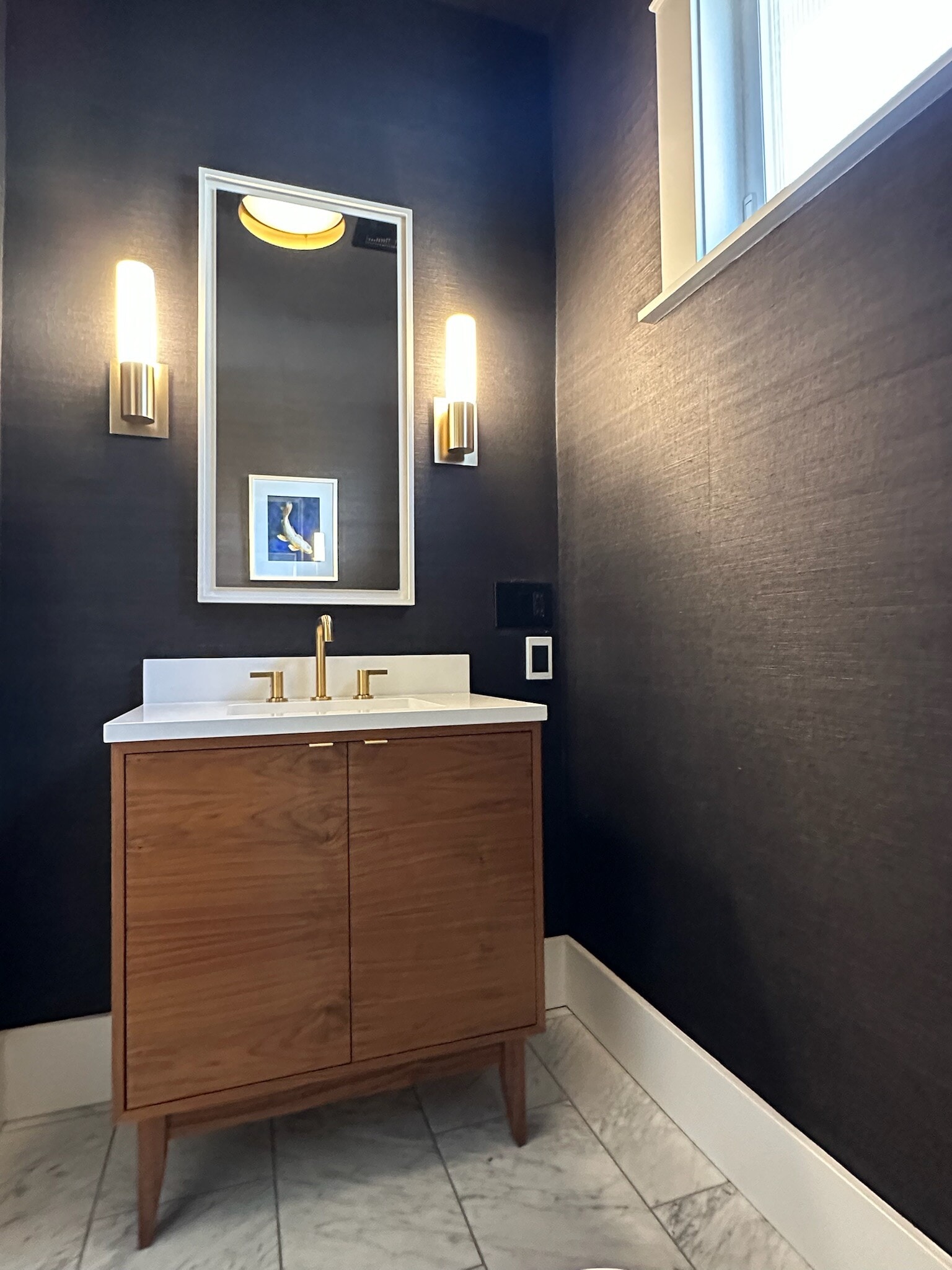Main level powder room with grass cloth wallpaper - 211 W Boston St