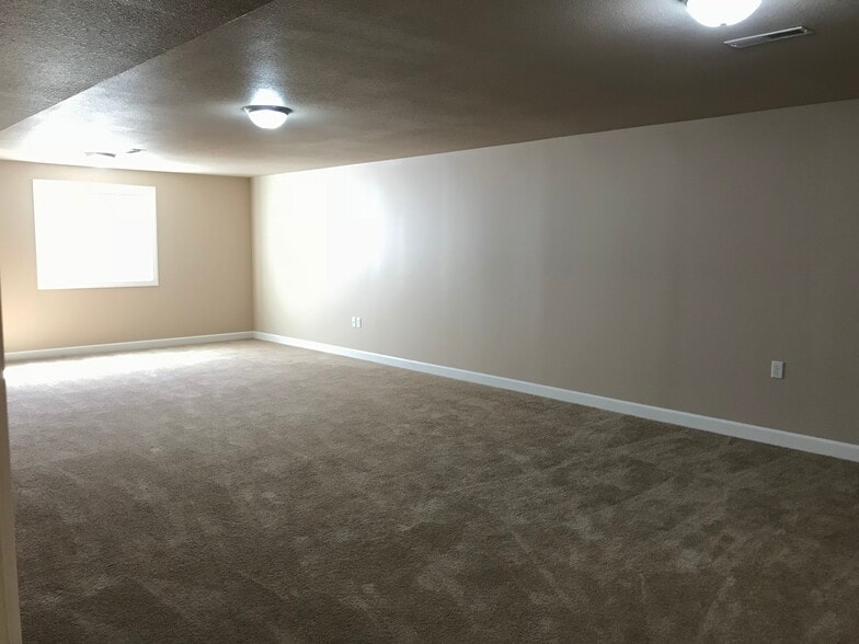 Half finished basement with egress window. Possible 3rd bedroom. - 107 Scenic Drive