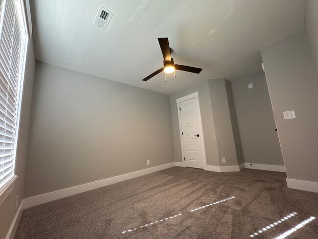 Building Photo - “Stylish 3BR End-Unit | Open Concept | Quartz Kitchen | Garage + Deck
