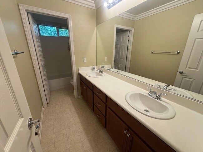 Building Photo - Spacious 4-Bedroom Home with Community Ame...