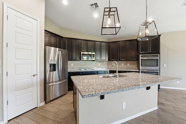 Building Photo - Stunning 4-Bed + Den Eastmark Home with Modern Upgrades Throughout