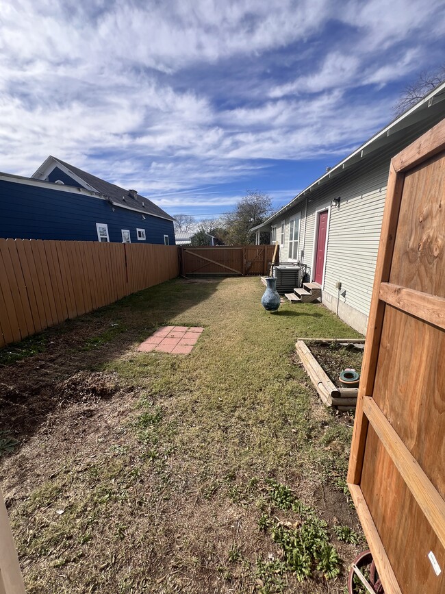 Backyard from inside large storage shed. - 422 S Olive St