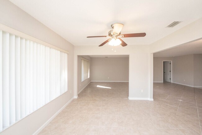 Building Photo - Welcome to this spacious three-bedroom, three-bath home in the heart of Palm Bay