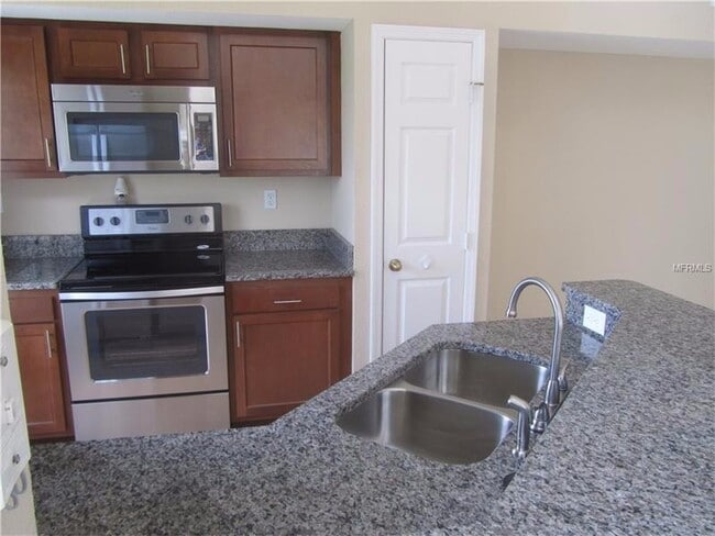 Building Photo - Water view condo with garage in sought after westchase