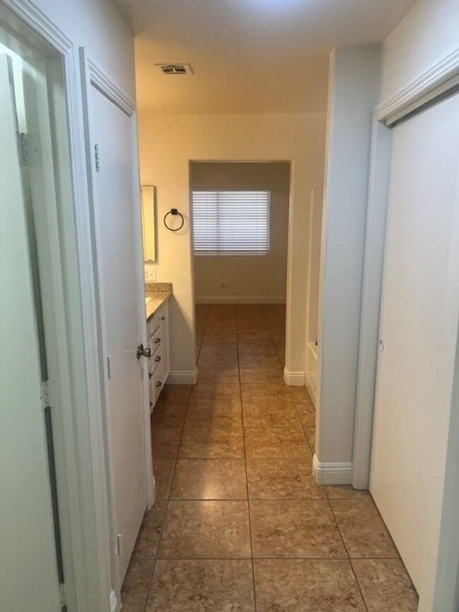 Building Photo - This three bedroom has the primary bedroom on the downstairs level.