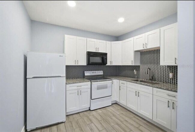 Building Photo - 1411 E 24th Ave